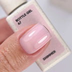 NAILSOFTHEDAY Bottle Gel 47 Shimmer — gel ultrarresistente rosa lechoso con shimmer rosa para reforzar las uñas, 10 ml
