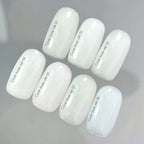 Nailsoftheday Cover base NEW Formula milk 06 — un tono lechoso, semitransparente con brillo azul que crea un efecto de tono más frío, una base de camuflaje para uñas, 10 ml.