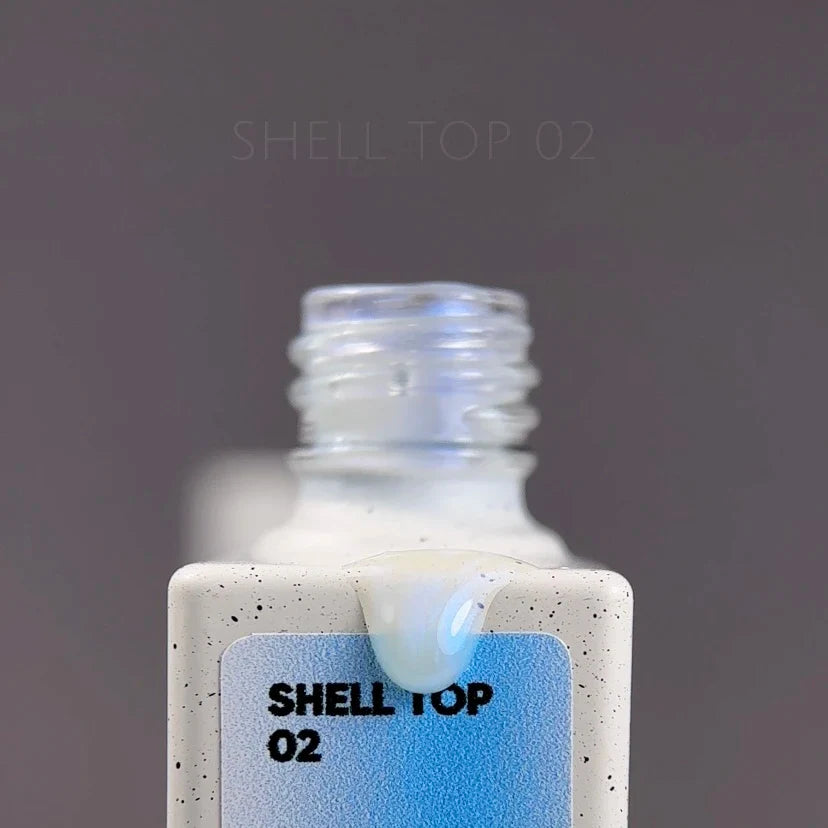 NAILSOFTHEDAY Shell Top 02 Nueva Fórmula — top perlado con efecto de frotado azul, sin capa pegajosa, 10 ml