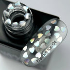 NAILSOFTHEDAY Kupidon Top 04 — top coat con corazones holográficos, sin capa pegajosa, 10 ml.