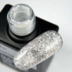 NAILSOFTHEDAY Potal base 33 — base semitransparente con destellos blancos y reflejos plateados finos, 10 ml.